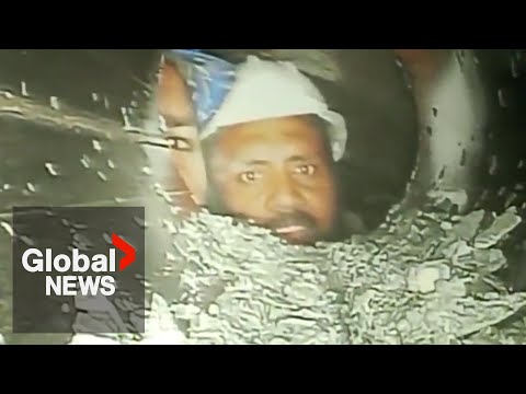 India tunnel collapse: 1st video of trapped workers brings relief to families