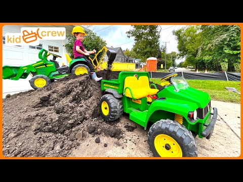 Hauling dirt and finding toy with kids backhoe digger and construction truck. Educational | Kid Crew