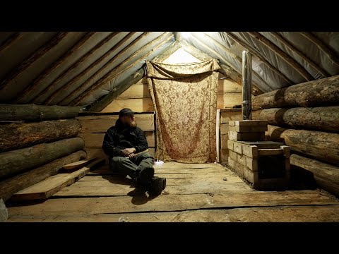 building the heart of an abandoned log cabin, brand new wooden stove , winter is here