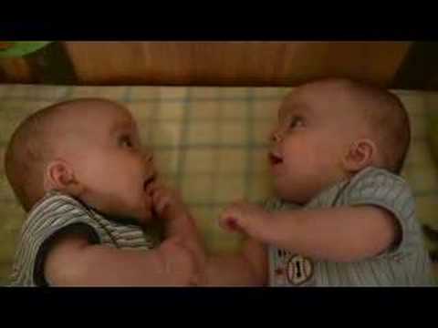 Twin Baby Boys Laughing at Each Other