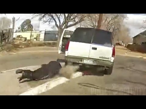 Officer Shoots at Fleeing Driver While it Dragged Another Officer