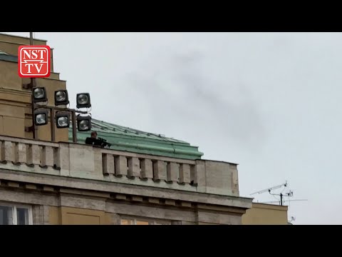 Video shows Prague gunman shooting from varsity balcony