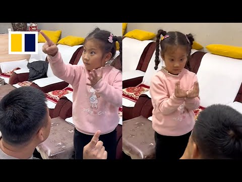 Little girl helps out as translator in deaf parents&rsquo; foot spa shop