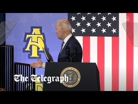 Moment Joe Biden shakes hands with thin air after speech