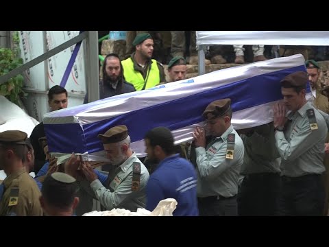 Hundreds of Israelis gather in rain in Jerusalem to mourn death an officer killed in Gaza