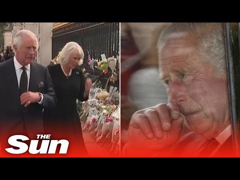 King Charles wipes away tears as he returns to Buckingham Palace greeted by mourners