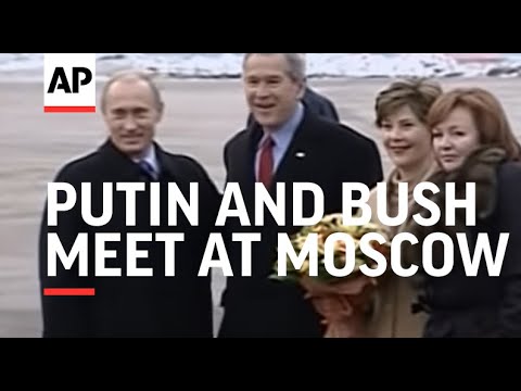 Putin and Bush meet at Moscow airport as US president heads to Asia