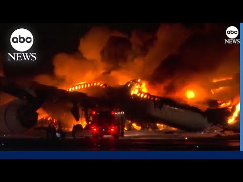 Plane engulfed in flames on runway at Tokyo airport