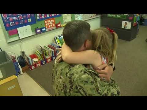 Navy officer surprises daughter at school