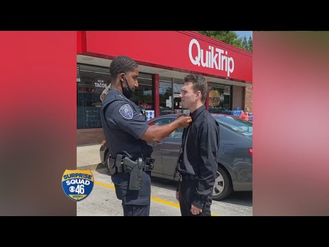 Police officer helps young man tie his tie receives a big surprise