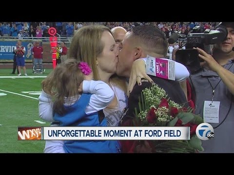 Marine surprises wife and kids at Detroit Lions game