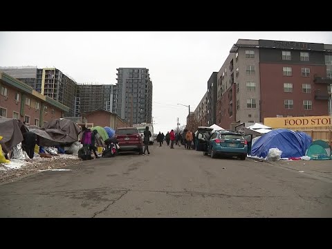 Migrants move to the streets after time at Denver shelters expires