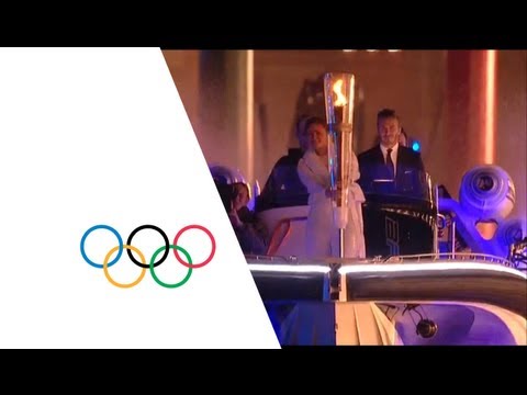 David Beckham &amp; Sir Steve Redgrave Pass Olympic Torch - London 2012 Opening Ceremony