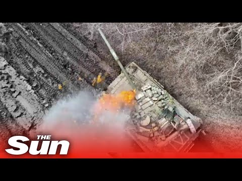 Russian tanks explode as Ukrainian drones drop bombs into open hatches