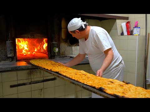 Two-meter long pizzas baked in a century-old wood-fired oven!