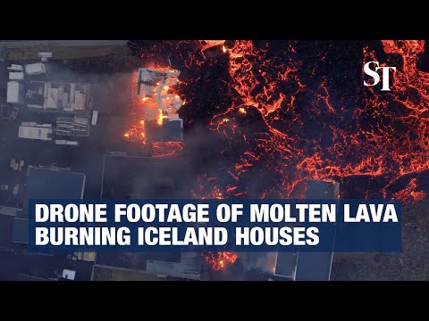 Drone footage of molten lava burning Iceland houses