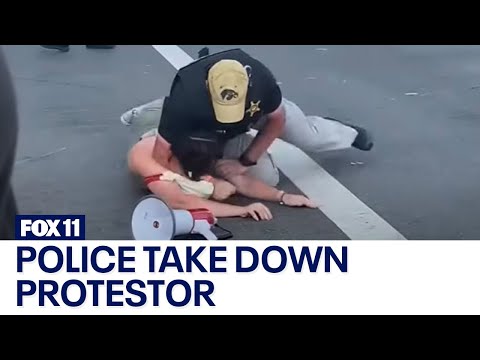 Police take down protestor approaching POTUS motorcade at Summit of the Americas