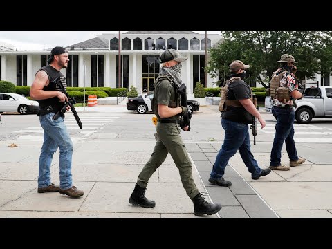 Armed group gathers and walks through downtown Raleigh