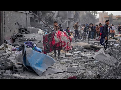 People mourn those killed in Israeli airstrikes on Deir al-Balah in Gaza Strip