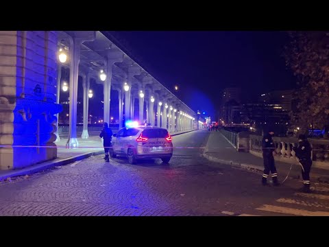 Police officers stand guard near site of Paris knife attack | AFP