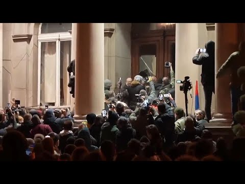 Police in Serbia defend capital's city hall as election protesters try to storm building