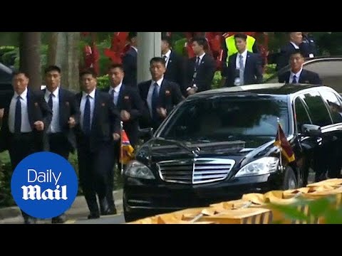 North Korean leader Kim Jong Un's security run alongside motorcade