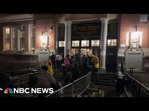 Migrants shelter in New York City high school during winter storm