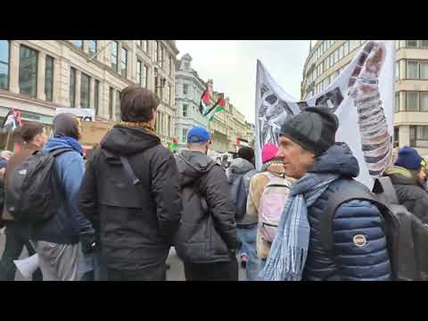 Scores of anti Zionist Jewish marchers protesting Israel's genocide of Gaza.