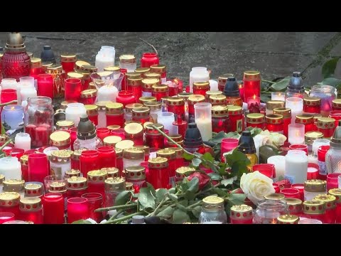 Mourners place candles outside university after Prague shooting