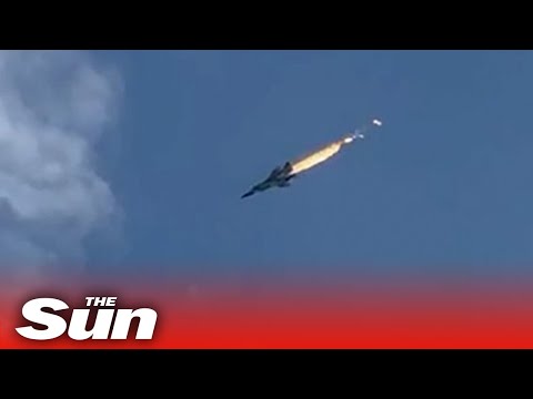 Russian fighter jet bursts into flames before crashing into lake