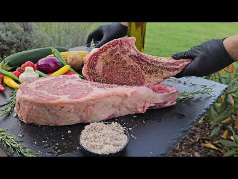 Beef tomahawk steak on Weber charcoal grill