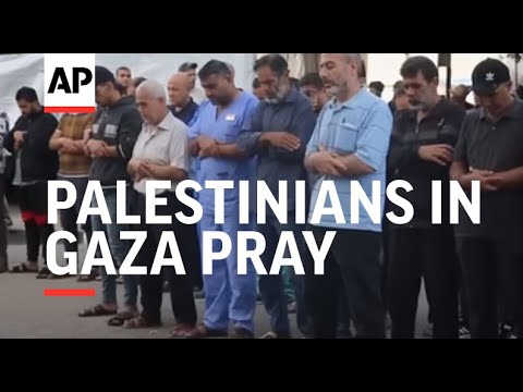 Palestinians in Gaza pray over dead as number killed pushes past 11,000