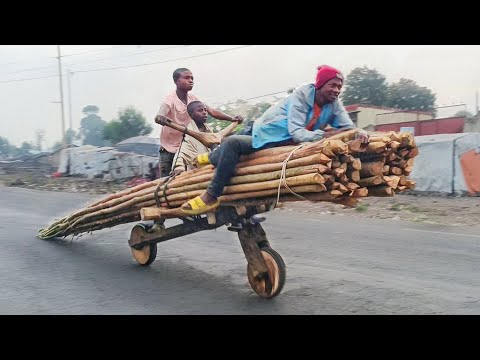 Riding Engineless Scooters on Streets of Congo