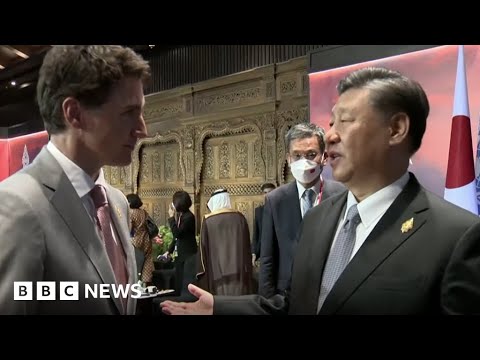 China and Canada leaders caught having tense exchange on camera - BBC News