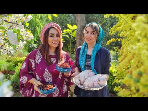 Preparing Nardoni chicken, pomegranate stew with chicken in a sunny day in Iran village