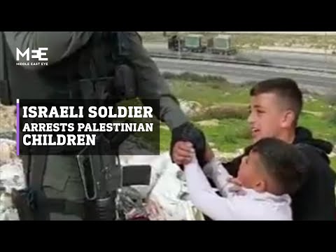 Israeli soldier arrests Palestinian children