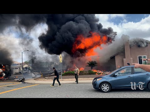 Moments after a plane crashes into homes in Santee