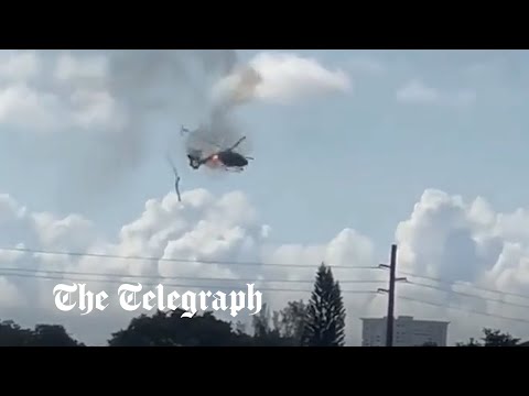 Burning helicopter crashes in Florida leaving two injured