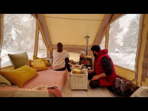 CAMPING WITH FIRE STOVE IN INFLATABLE TENT IN SNOWSTORM