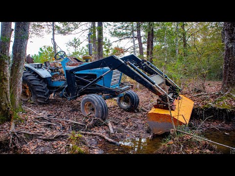 We pulled a HUGE FARM tractor from a creek! This antique needs some work!