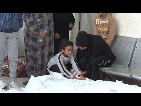 Boy and girl cry for their father killed in Israeli strike on Rafah in southern Gaza