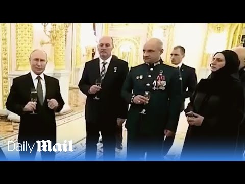 Putin brags Ukraine &lsquo;has no future&rsquo; while swigging champagne with soldiers at the Kremlin