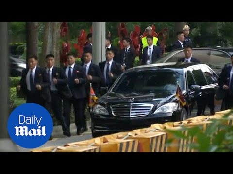 Kim Jong Un's bodyguards run beside his limo in Singapore