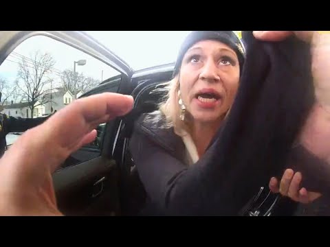 Woman Refuses To Get Out of Stolen Car, Police Pull Her Out