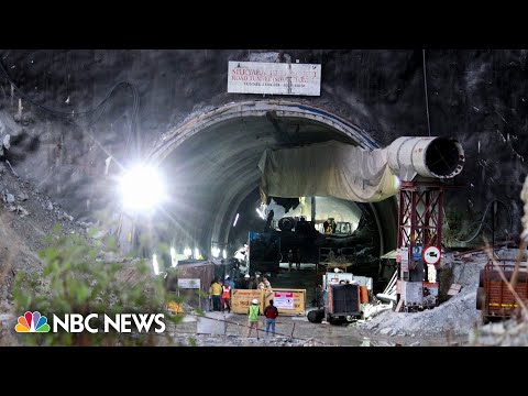 Rescuers race against time to free construction workers trapped in Indian tunnel