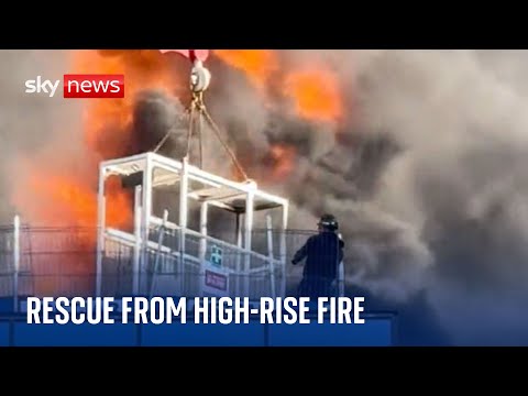 Worker rescued by crane as large fire breaks out at high-rise building in Reading