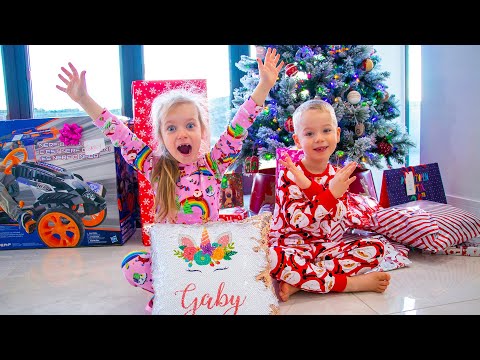 Gaby and Alex opening presents on Christmas morning 2020