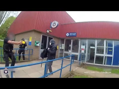 Armed police tackle bomb hoaxer at police station