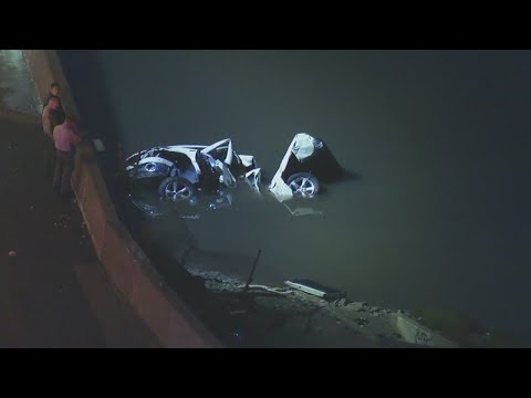 Car plunges into water off freeway amid wet conditions